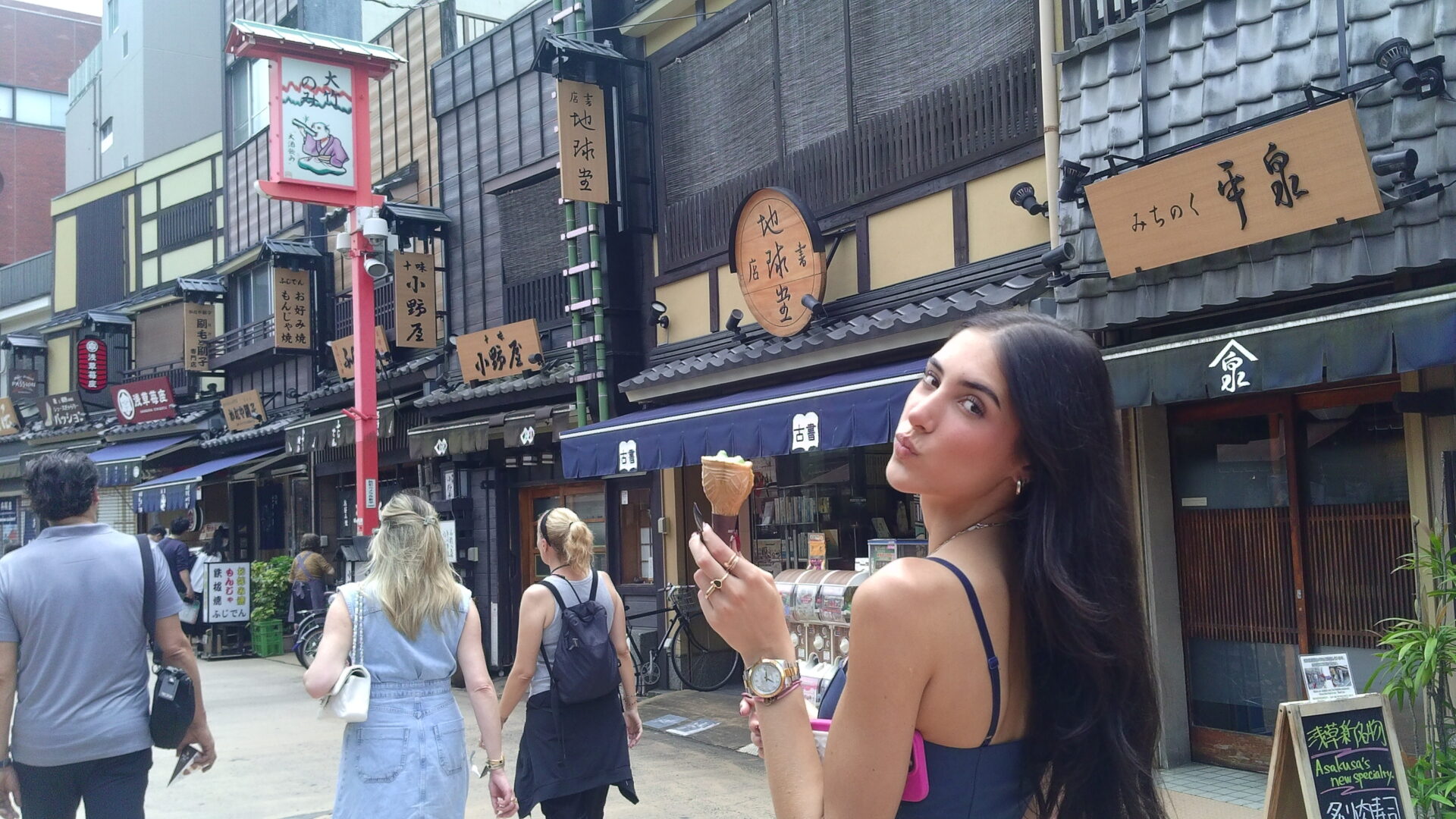 A woman holding up two pieces of food.